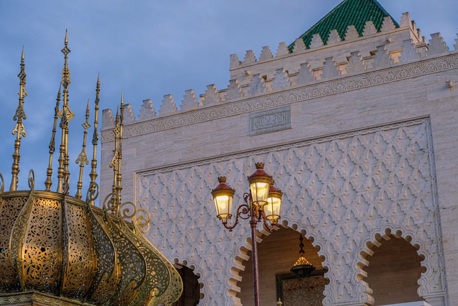 Beautiful Moroccan architecture with ornate lamps and intricate designs at sunset.